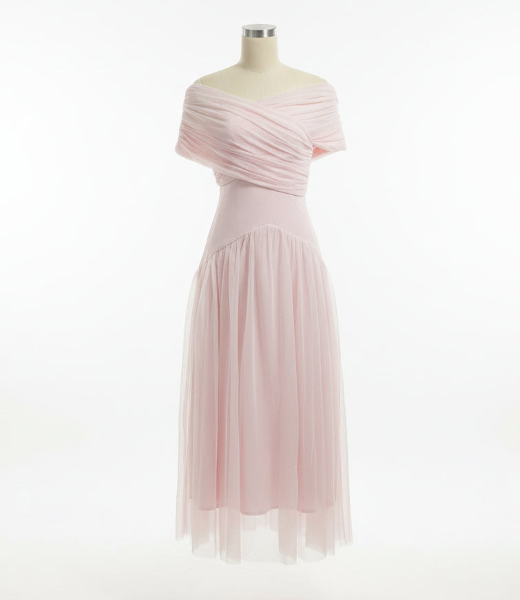 Mannequin wearing a light pink dress