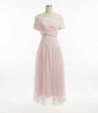 Mannequin wearing a light pink dress