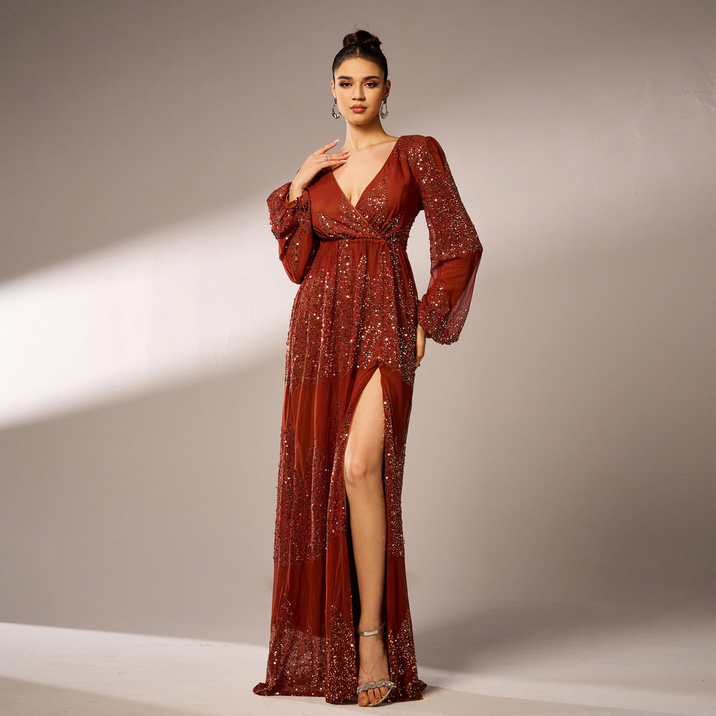Rust sequin maxi dress walking pose with slit