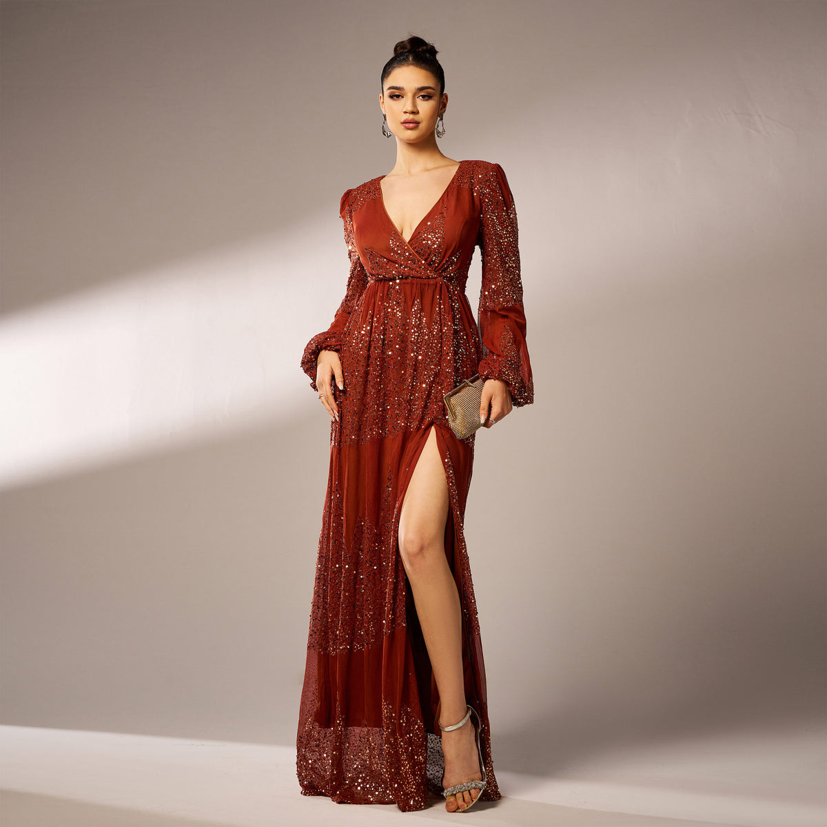 Rust sequin maxi dress styled with clutch