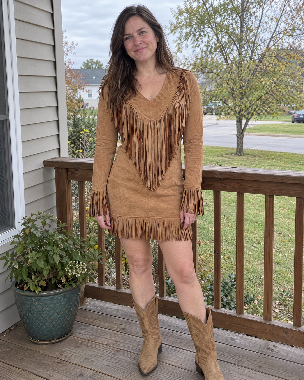 dakota fringe suede v-neck long sleeve mini dress in brown - outdoor full length view