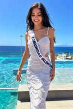 Woman in a white dress with a sash on her occasional date celebration day