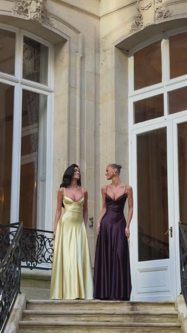 Alana satin gown in Milky Yellow and Dark Purple, two models on the stairs