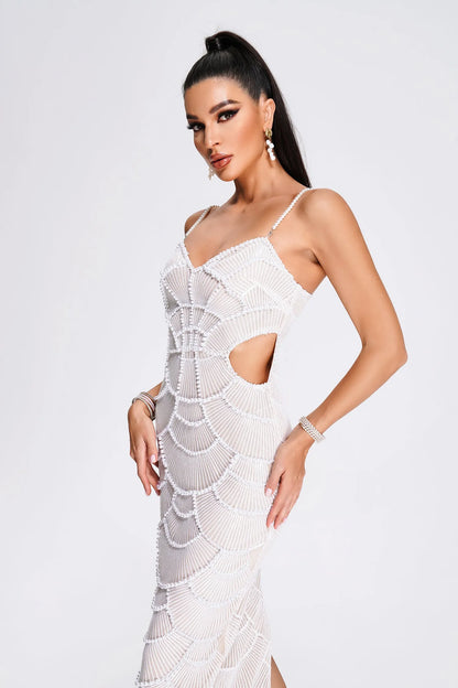 Woman wearing a white crochet dress on a white background