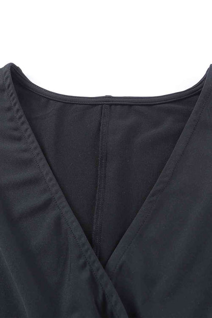 Twisted Plunge Three-Quarter Sleeve Jumpsuit Trendsi