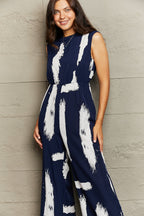 Printed Round Neck Cutout Jumpsuit with Pockets Trendsi