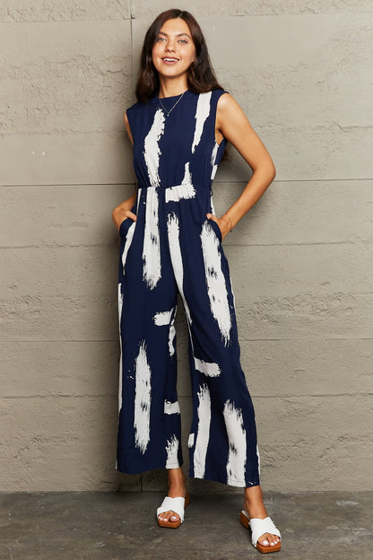 Printed Round Neck Cutout Jumpsuit with Pockets Trendsi